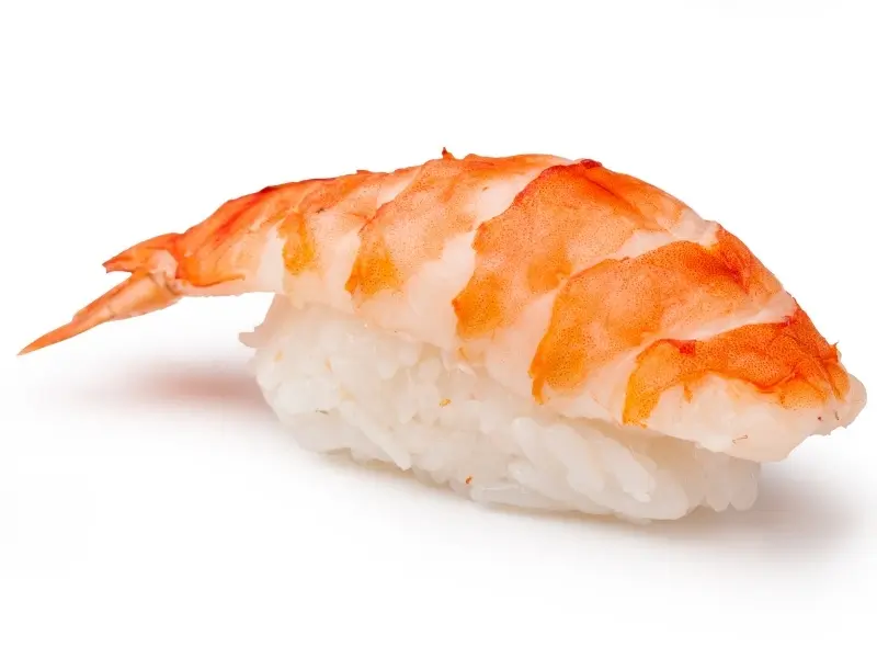 Fresh salmon sashimi slices served with shredded radish, lemon, and cucumber at Oishi Sushi & hibachi, a Japanese Restaurant in Derby